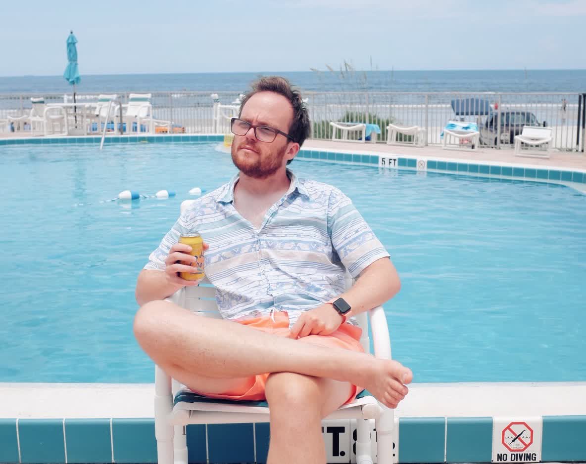 Peter looking cool in front of a pool